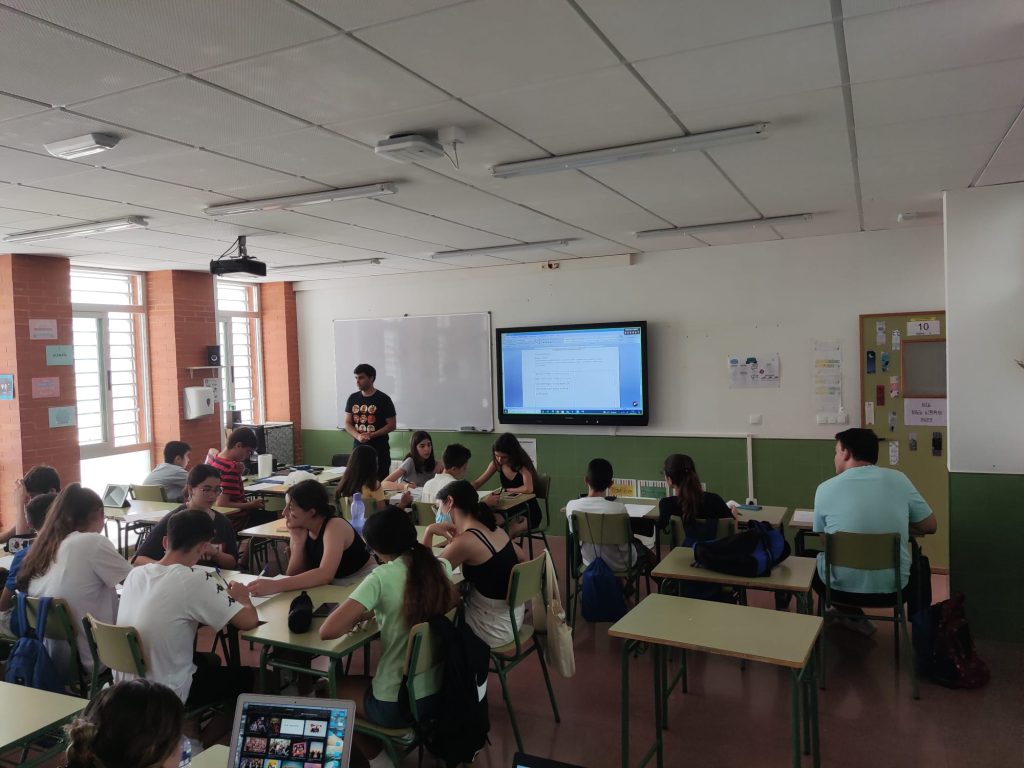 Felipe teaching in a video game localization workshop at a summer camp.
